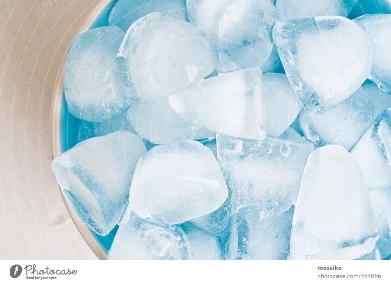 close up of ice cubes in a blue bowl - studio shot from above Bowl Lifestyle Kitchen Restaurant Water Freeze Cool (slang) Bright Clean Blue White Purity