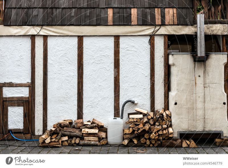 Behind the bakehouse you can see the backside of the stove, next to it firewood is piled up kiln Baking Baker stand Markets Bread Food ardor Cakes and pastries