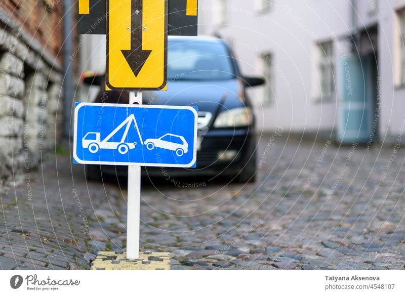 Tow away zone road sign with car on background tow parking forbidden towing tow away prohibited city street traffic symbol transportation truck vehicle warning