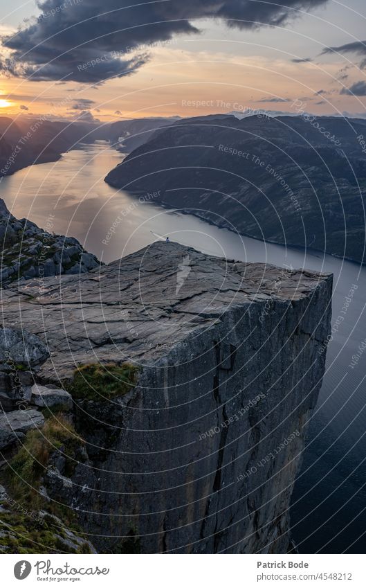 View to the Preikestolen at the Lysefjord in Norway Fjord Water Mountain Scandinavia Hiking Sunrise tourism vacation Scandinavian wallpapers Nature Landscape