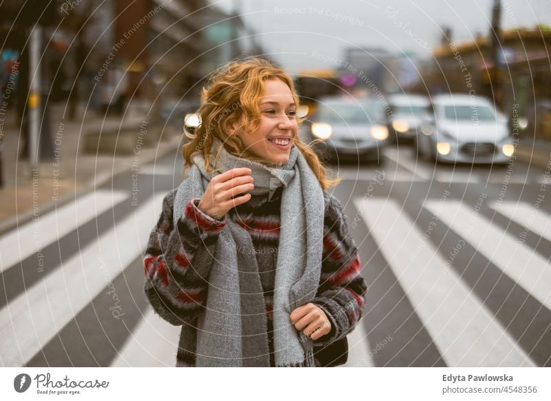 Young woman on a crosswalk one person adult beautiful casual female girl people lifestyle urban city street attractive town portrait young millennials Warsaw