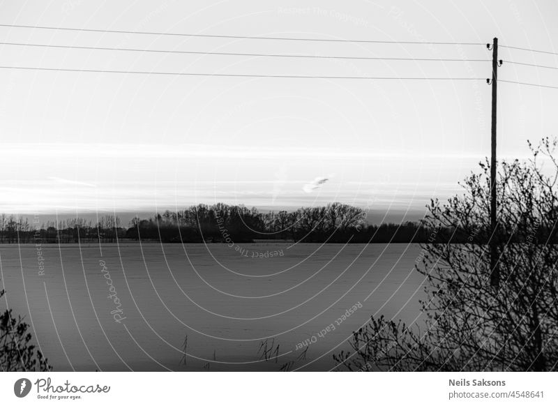 sunset with snow and electricity sky frost winter frozen blue landscape wire pole dawn field outdoor gravel atmosphere power lines natural cable nature