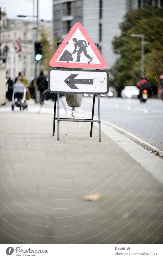 Construction site sign with arrow in a city construction site sign Town Signage construction industry Warning sign Arrow esteem Signs and labeling