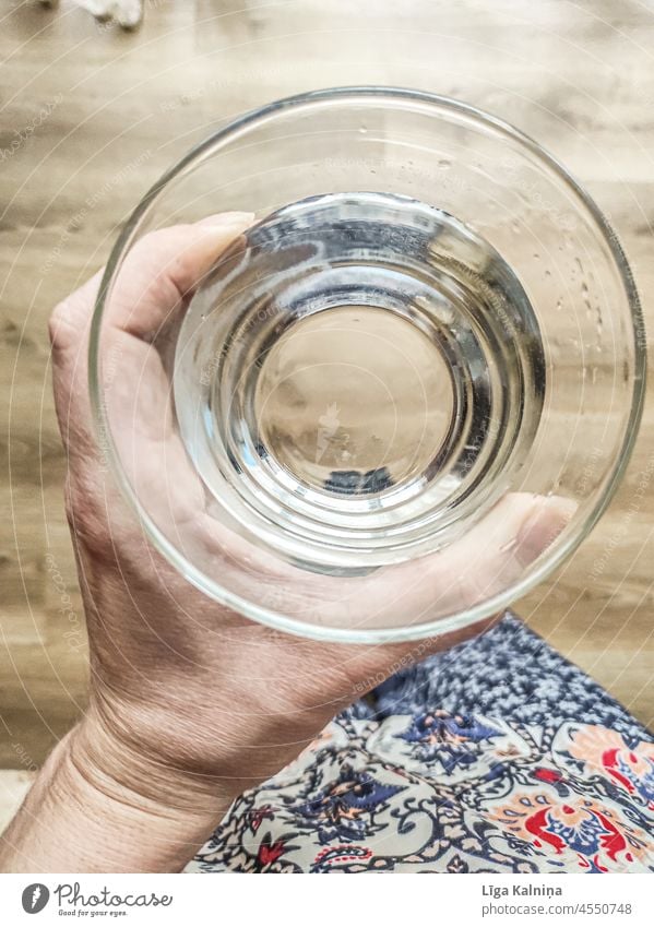 Hand holding a water glass Water Drinking water Cold drink Glass Beverage Thirst Healthy Mineral water Thirst-quencher Fresh Refreshment Close-up Thirsty