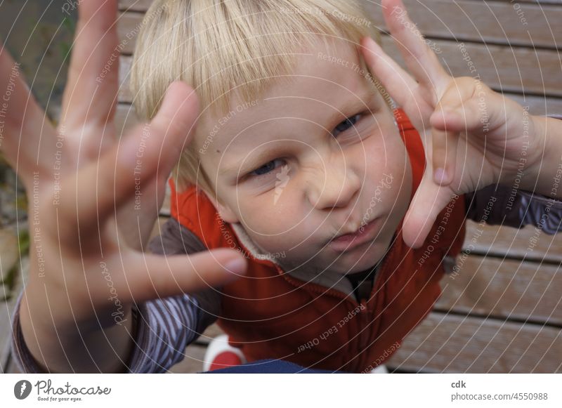 Childhood | Enough now!! Boy (child) Grimace hands Gestures Face eye contact Infancy Blonde out standing gesticulating orange vest Sign Language Hull nose