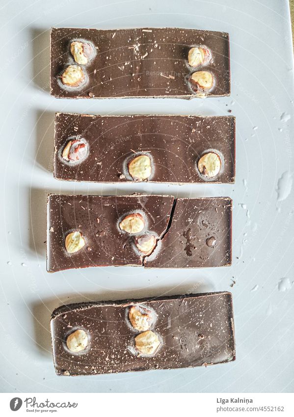 Cut chocolate with nuts Chocolate Chocolate cake Dessert Food Sweet Delicious Candy Brown Shallow depth of field Close-up Nutrition Food photograph