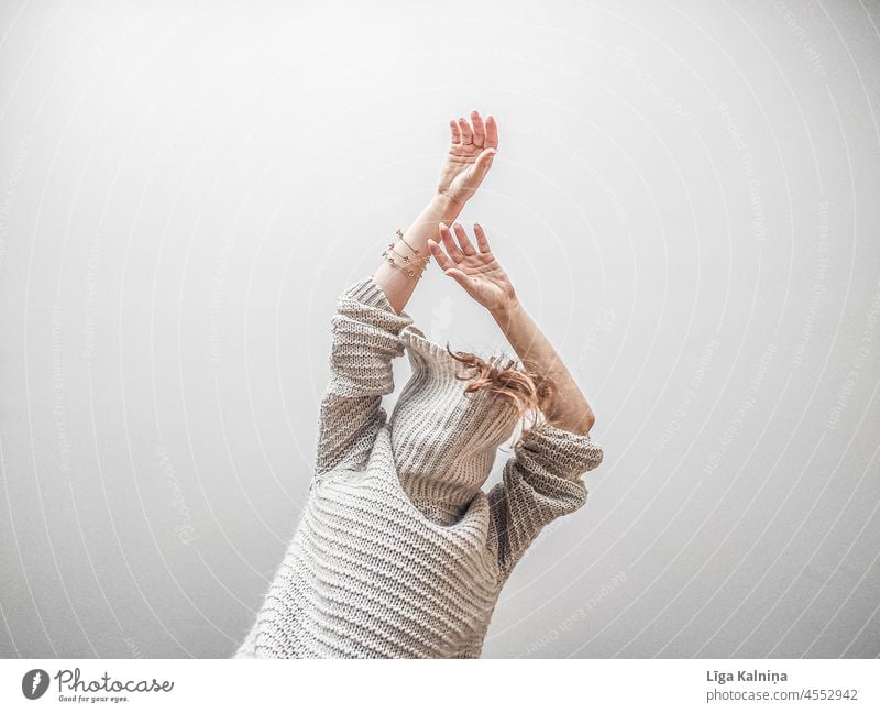 Anonymous woman in a big oversized sweater with raised arms Sweater Knitted sweater Wool sweater Warmth Interior shot Clothing Fashion Soft Woman Cozy