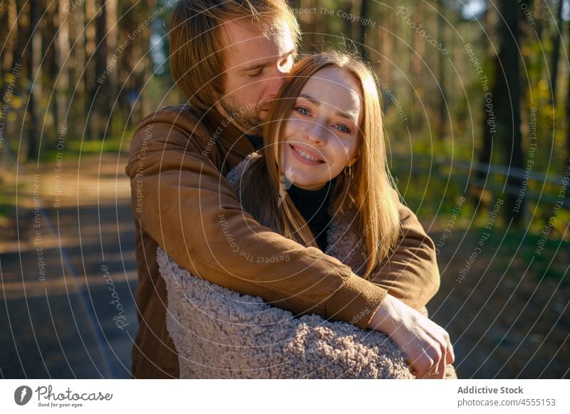 Romantic couple hugging in nature romantic love relationship affection caress fondness cuddle date girlfriend boyfriend woman bonding tender together in love