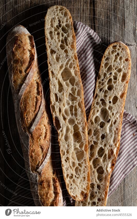 Sourdough baguettes located on table sourdough food baked tasty cut pastry crunch bakery crust pore half homemade cookery whole organic delicious product