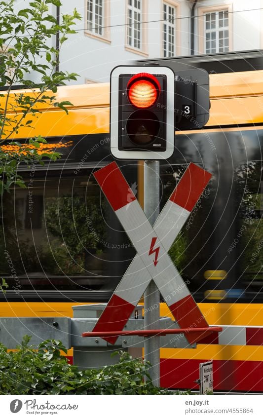 St. Andrew's cross with traffic light in front of tramway Traffic light Red red traffic light St. Andrew's Cross Tram Transport Road sign Traffic infrastructure