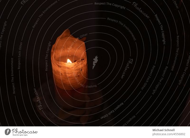 Candle in a church shoulder stand Candlelight Light Flame Church Dark Candle flame Illuminate Fire Moody Hope