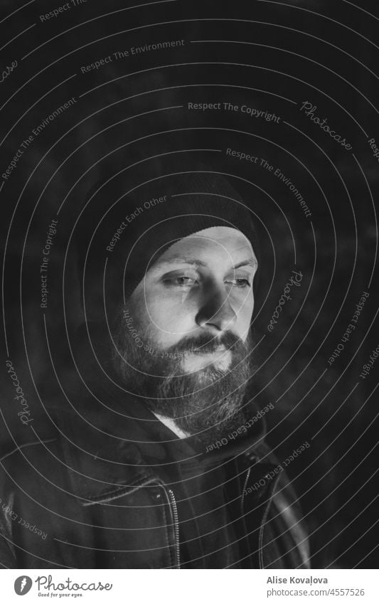 portrait of a man beard hat black and white portrait sad sad look Human being Looking smoke blurry vertical shot