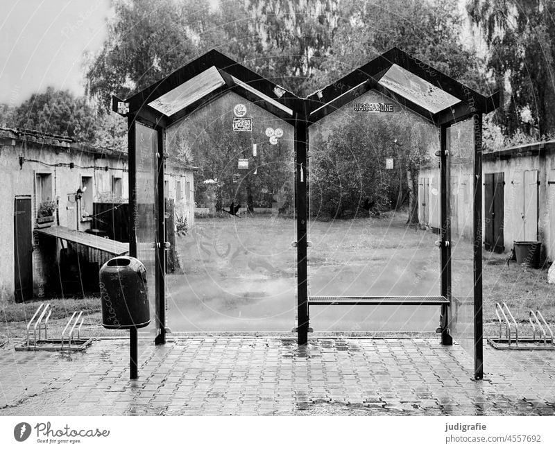 Bus stop in Groß Mohrdorf Stop (public transport) Bicycle rack Roof Glass Village Garage doors Rain Wait Public transit Traffic infrastructure Transport