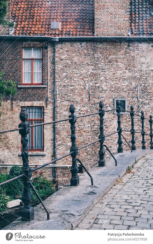 A stone bridge and houses in the background in Bruges, Belgium bruges Bridge Stone Old town medieval