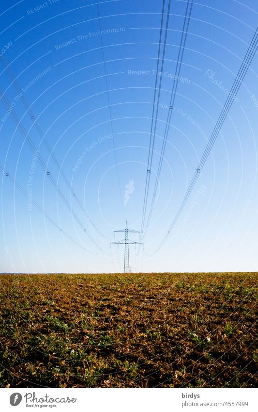 High voltage power line with power pole in a field. Power line Electricity pylon Energy industry Power transmission power supply transmission line stream Meadow