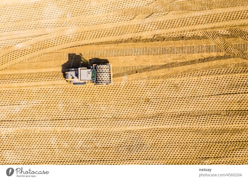 Aerial view, close up details of highway construction site - industrial machinery, vibratory soil compactor working Agricultural Machinery Asphalt