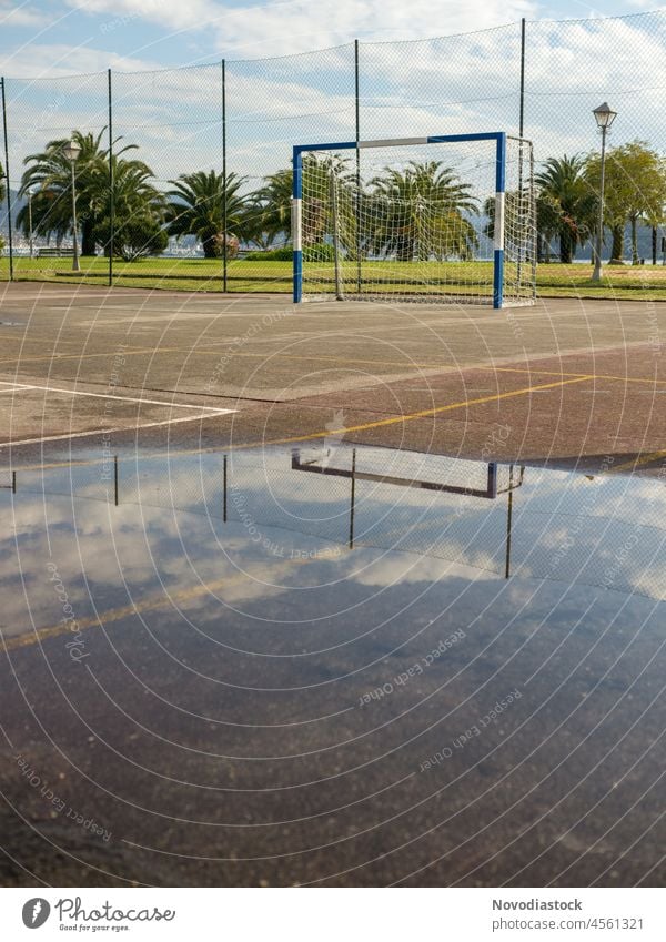 Empty football goal after a rainy day Goal Soccer Goal Sports soccer field Playing field Exterior shot sport abandoned soccer goal park old playing playground