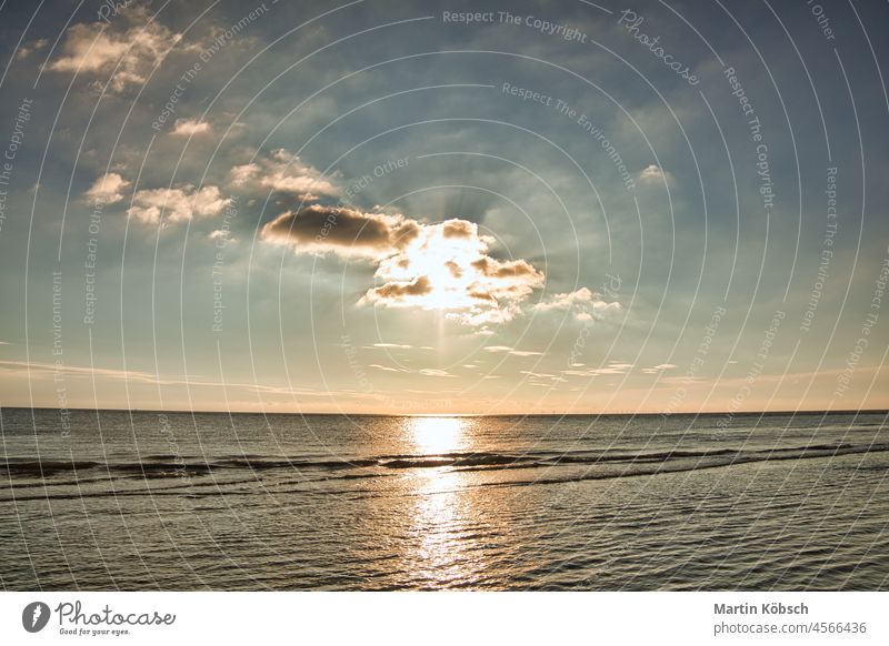 Sunset on the stand of Blåvand Denmark. Evening hours in warm light mood sunset sea beach wave vacation sand recreation dune north sea see travel baltic sea