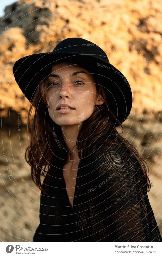 Italian girl on the beach of Formentera with black hat alone attractive beautiful beauty bikini body brunette care coast cute fashion female freedom fresh