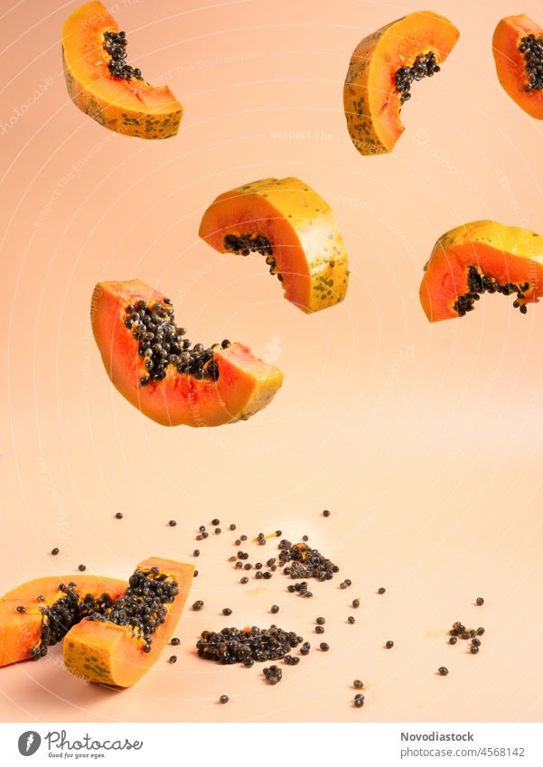 Papaya fruit slices in the air healthy orange fresh tropical open pulp vitamin object fragrant sweet ripe cut refreshing juicy papaya seed meat cook summer