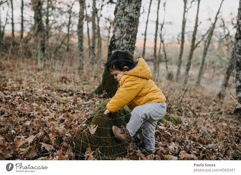 Child climbing small rock childhood 1 - 3 years Caucasian Playing Leisure and hobbies Childhood memory Colour photo Authentic Lifestyle Infancy Human being Joy