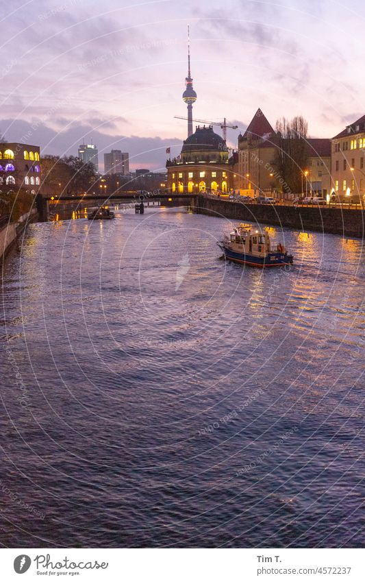 View over the Spree to the television tower and Bode Museum. In the foreground the water police is driving. Television tower river Berlin Capital city