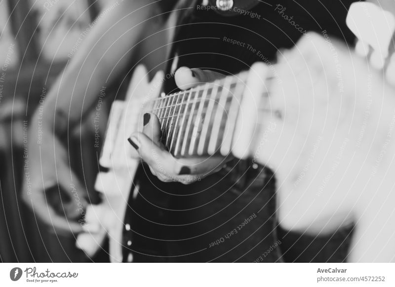 Close up of a pair of hands playing a guitar outdoors. Sunny day and practicing an instrument concept. Copy space music life on tour and nature. artist band