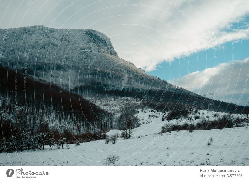 Snowy mountains with clouds in winter adventure background beautiful blue bosnia and herzegovina cold destination esmeralda lake forest hiking holiday ice