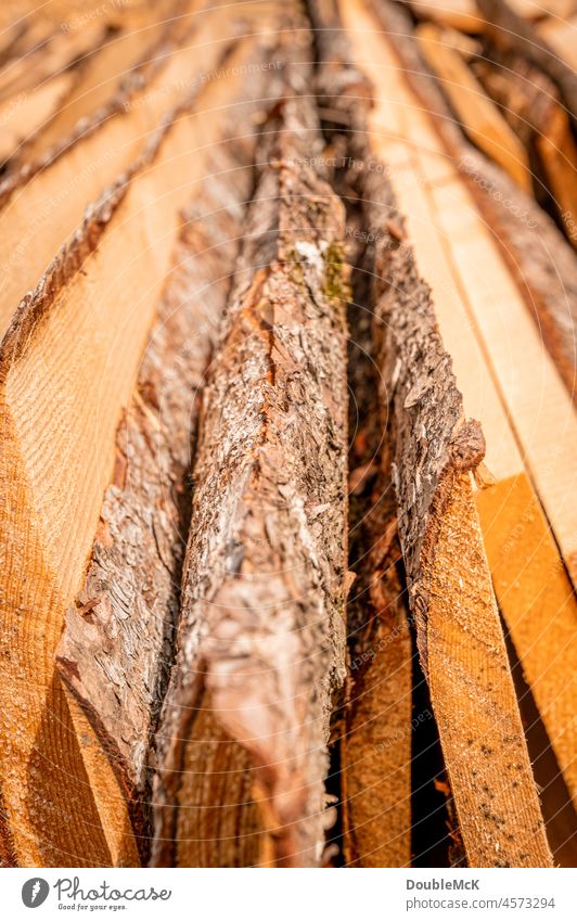 Wooden slats lying next to each other with tree bark as a closeup wooden slats Stack Heap stacking Collection Logging Wooden boards Woody further processing