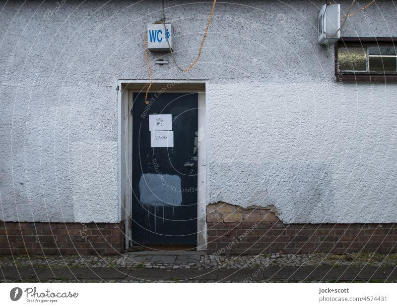 WC Ladies LAVATORY Toilet Front door Access Pictogram Lady comfort station Characters Signage behind closed door Signs and labeling Facade dreariness