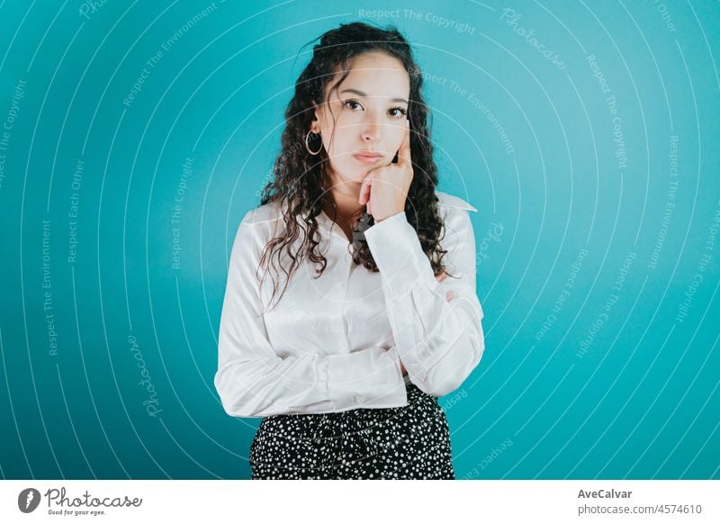 Young black business woman smiling, looking happy, confident and friendly. Portrait of her she nice well-dressed. Folded arms isolated over bright vivid shine vibrant Blue color background