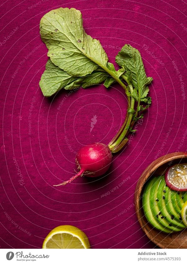 Assorted ingredients for dish cucumbers avocado radish and lime vegetable food slice chia seed assorted organic fresh meal fruit healthy cut arrangement