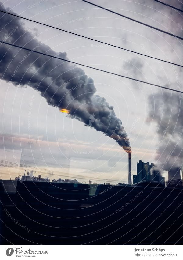 Smoke from fossil fuel chimney as it passes by Smog Disappointment Climate change Responsibility Arrogant High spirits climate crisis Environmental damage Coal