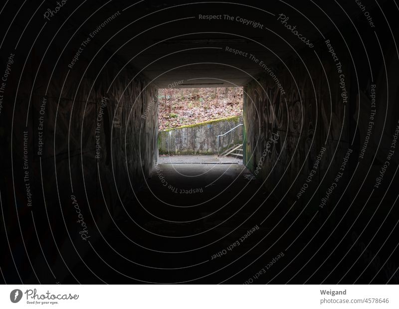 There is light at the end of the underpass depression Tunnel Dark sad somber Grief urban Underpass peril Gloomy Black Square Stairs Light off Autumn Concrete