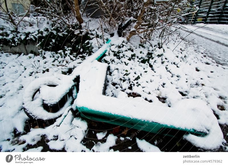 Scooter under fresh snow e-roller snowed in more eroller locomotion Lie Deserted scooter tranquillity Snow Snow layer Town Stand silent Copy Space Tourism