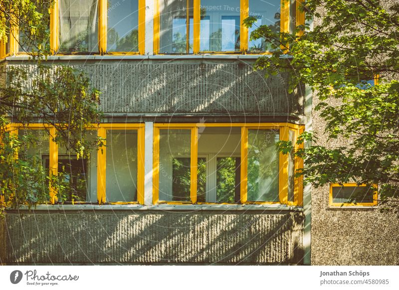 Facade with glazed balconies winter garden apartment block trees Tree Green Summer block of flats dwell living environment Rent Apartment Building