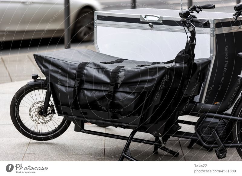 modern cargo bikes in a row in a city cargo bicycle cargo bicycles modern bicycles green cargo strong bicycles tire stone sport transportation