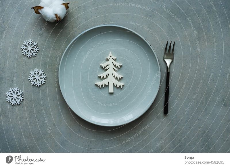 A table set for Christmas with a grey plate Plate Gray have wine Table Christmas decoration Fork christmas tree Christmas & Advent Christmas tree Tradition