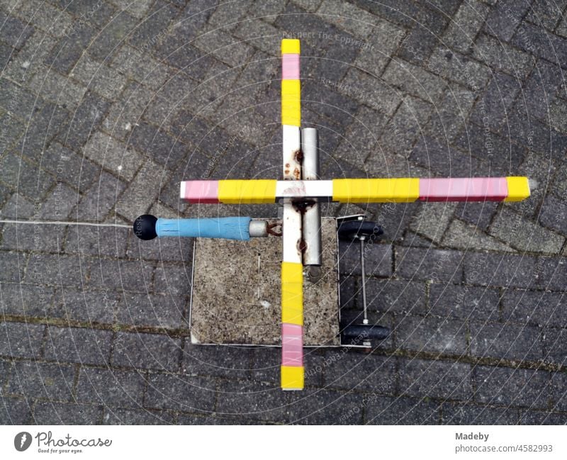 Self-built bracket for stretching a steel cable as a barrier in front of a yard entrance in Oerlinghausen near Bielefeld in the Teutoburg Forest in East Westphalia-Lippe