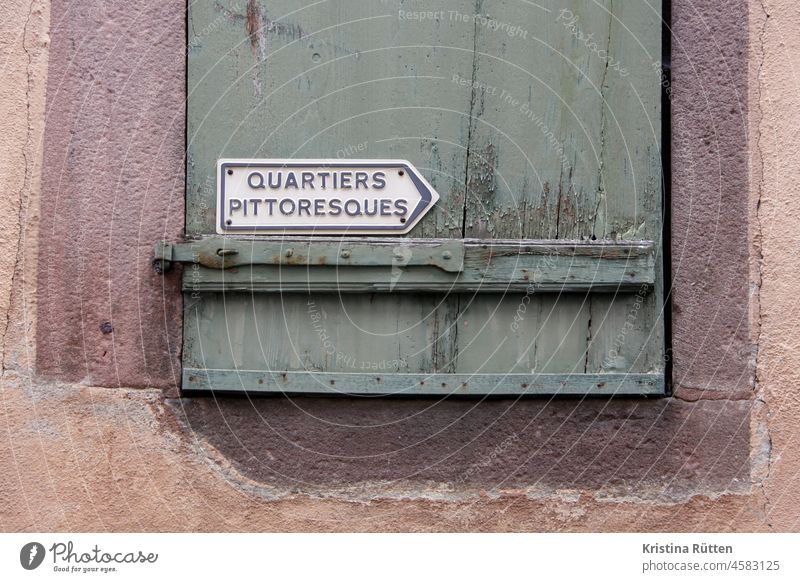 french signpost to a picturesque quarter in elsass Neighborhood Picturesque Arrow Direction off Road marking Shutter Old town Area location Town Place France