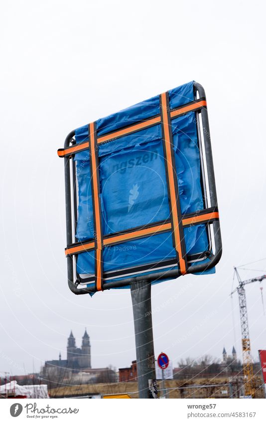 wrapped warm Road sign Foil bag Garbage bag blue garbage bag blue foil Construction site Dome Magdeburg Cathedral Elbe bridge construction site Colour photo