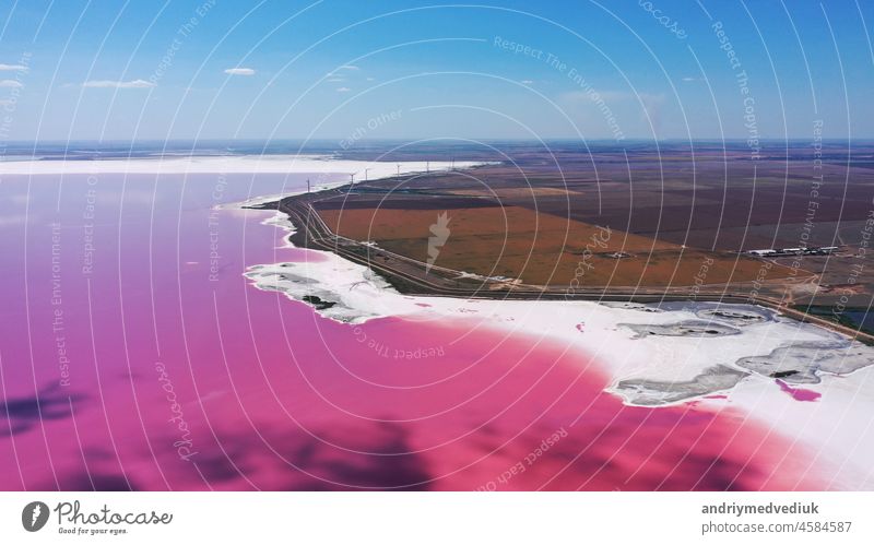 aerial view to pink lake with salt shore with little islands with copy space in Ukraine single ukraine above red red lake reflection salt lake sand pattern sky