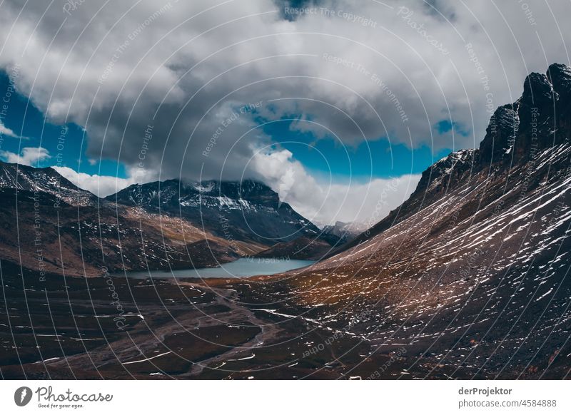 Hike Vanoise National Park: View of mountain in fog with lake in foreground Central perspective Deep depth of field Contrast Shadow Light Day Deserted