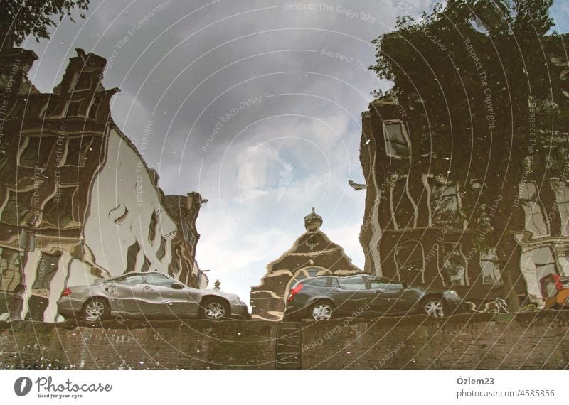 Houses and cars reflected in the water. In Amsterdam. Exterior shot Town Water reflection Netherlands Reflection House (Residential Structure) River Channel