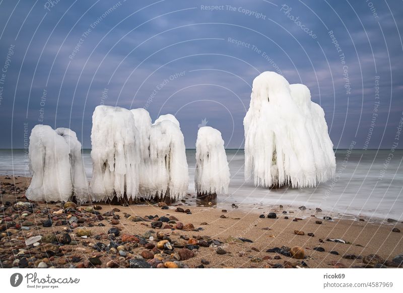 Buhne in winter on the coast of the Baltic Sea near Kühlungsborn. Break water Winter Ice Beach Baltic coast Ocean BUK stones Clouds Nature Landscape vacation