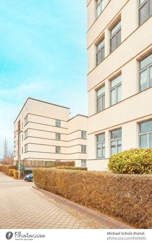 Bauhaus building in warm pastel colours Magdeburg modern new Build Architecture settlement minimal Colour shape surface Geometry Hedge