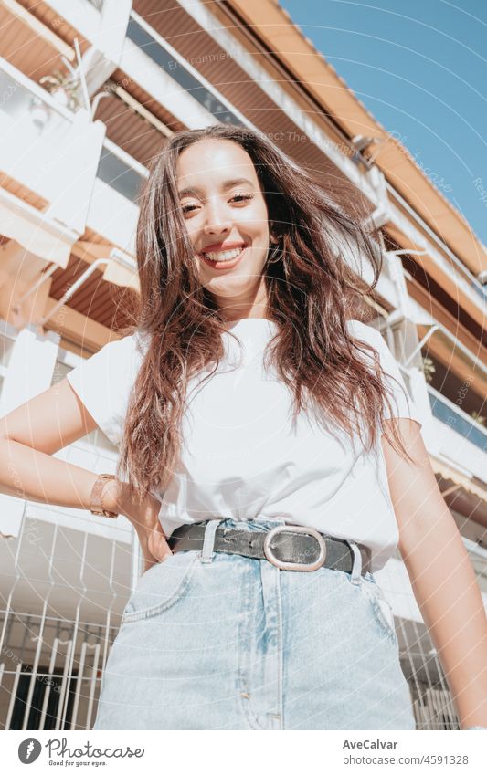 Smiling and cool young african arab lady looking at camera on street style and posing on diferent ways. Close-up portrait. Cute girl smiling - People, enjoy life, student lifestyle, city life, travel