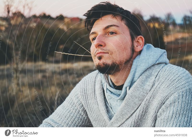 Delicate image of a young man touching nature delicate fragile new modern masculinity natural male real people lifestyle detail concept silence quiet patience