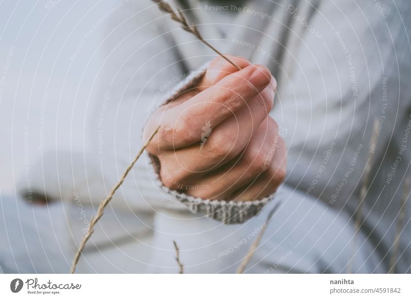 Delicate image of a young man touching nature delicate fragile new modern masculinity natural male real people lifestyle detail concept silence quiet patience