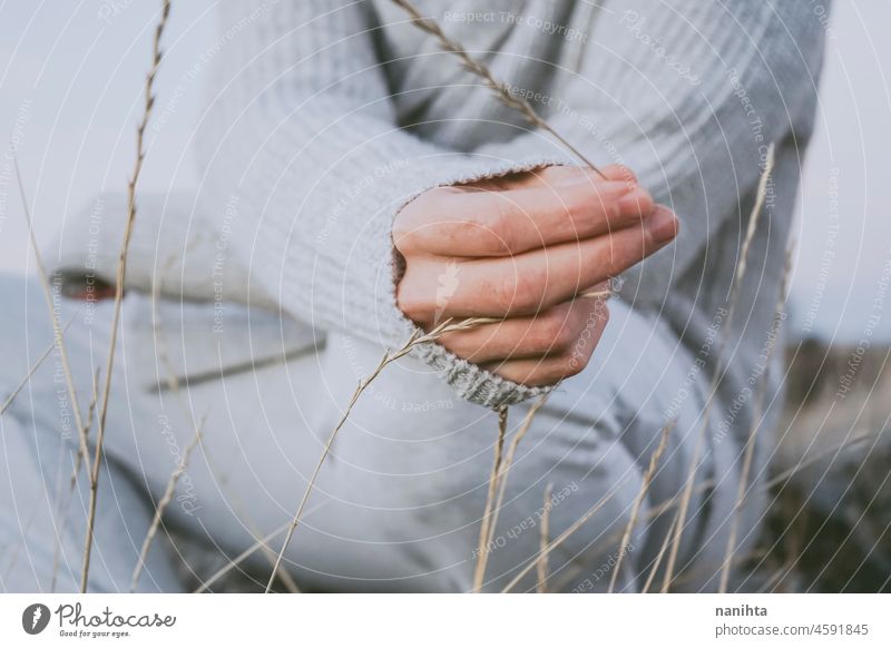 Delicate image of a young man touching nature delicate fragile new modern masculinity natural male real people lifestyle detail concept silence quiet patience